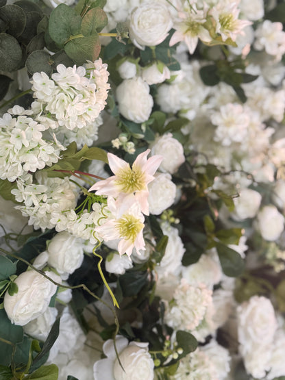 Macro close-up of Daydream flower wall rental blooms with white hydrangea, blush clematis, white ranunculus, and lush eucalyptus | Reno, Lake Tahoe & Sacramento