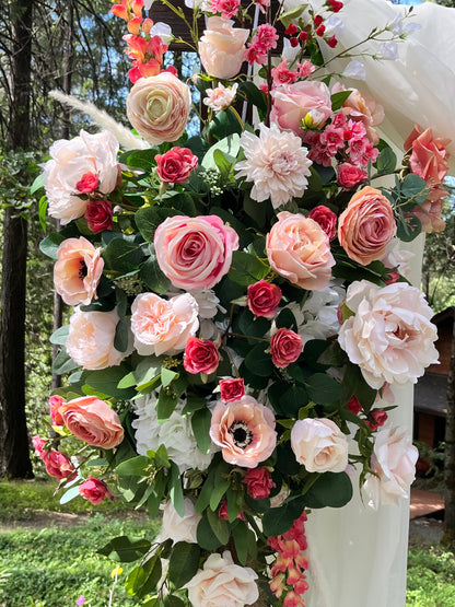 Close-up of Delicate arch adornment rental featuring blush garden roses, ranunculus, anemones, dahlias, and snapdragons on white arch post at outdoor forest wedding | Reno, Lake Tahoe & Sacramento