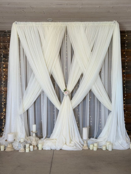 White chiffon drapery rental styled as flowing ceremony backdrop with knotted tie detail at outdoor wedding | Reno, Lake Tahoe & Sacramento