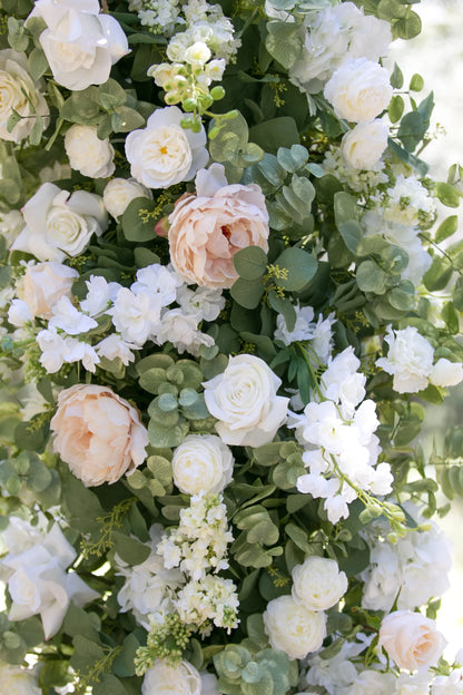 Close-up of Enchanted arch rental florals with cream roses, blush peonies, white delphinium, white snapdragons, and lush eucalyptus | Reno, Lake Tahoe & Sacramento