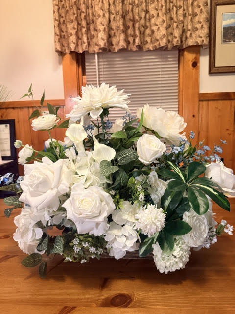 Enchanted Centerpiece with blue delphinium accents, angled view