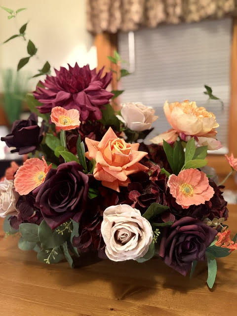 Evermore Centerpiece wide shot showing full height and volume with burgundy and plum florals