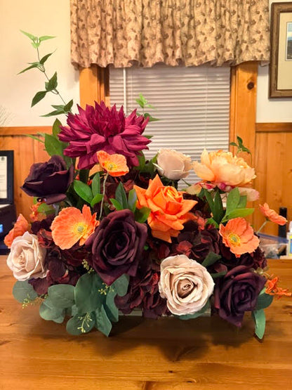 Evermore Centerpiece close-up of plum roses and coral poppy