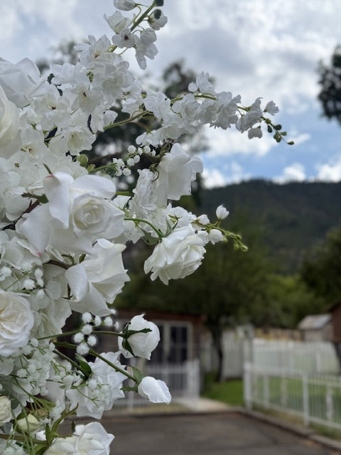 Close-up of Fairytale double moon arch rental blooms with white garden roses, white delphinium, and baby's breath with mountain backdrop | Reno, Lake Tahoe & Sacramento