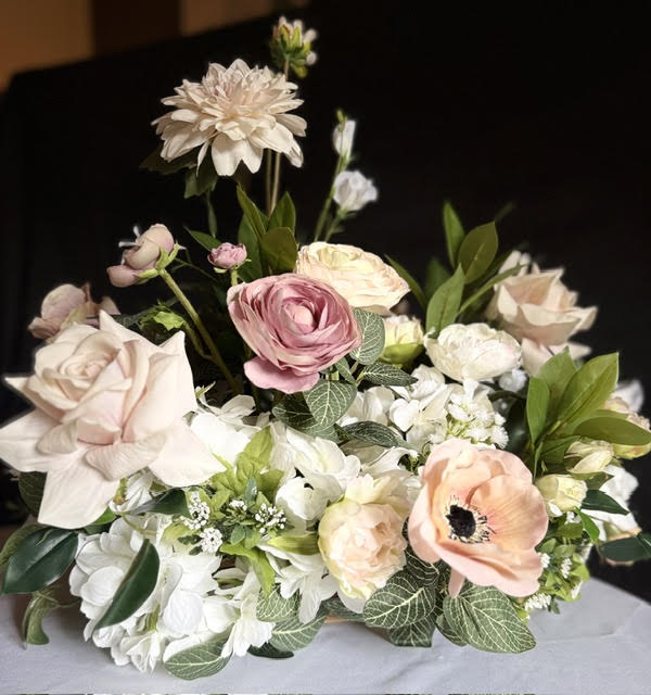 Large Love Story Centerpiece, warm light on white tablecloth
