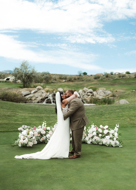 Blush and white aisle flower rental cluster with roses, hydrangea, and eucalyptus lining outdoor wedding ceremony aisle | Reno, Lake Tahoe & Sacramento