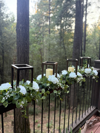 Set of wood structure centerpiece rentals with white roses and pillar candles at wedding reception | Reno, Lake Tahoe & Sacramento