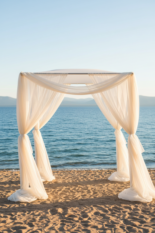 Chuppah rental with flowing ivory white chiffon drapery at outdoor Lake Tahoe beach wedding ceremony | Reno, Lake Tahoe & Sacramento