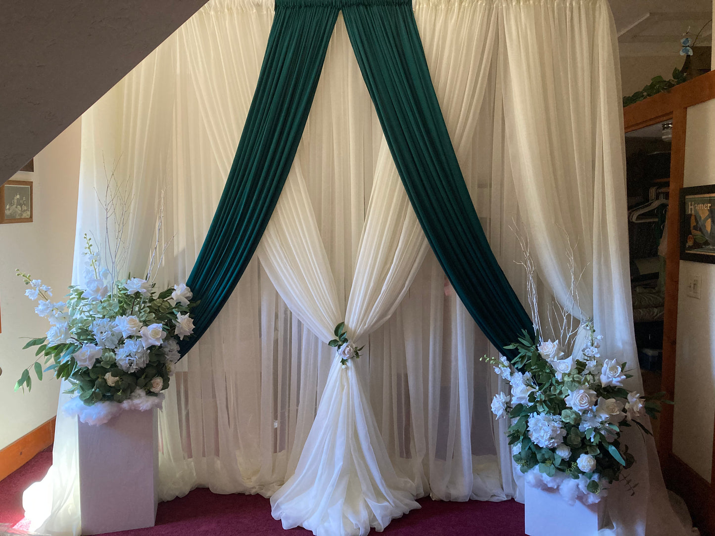 White chiffon drapery rental as full ceremony backdrop with white rose and greenery floral arrangement in natural outdoor light | Reno, Lake Tahoe & Sacramento