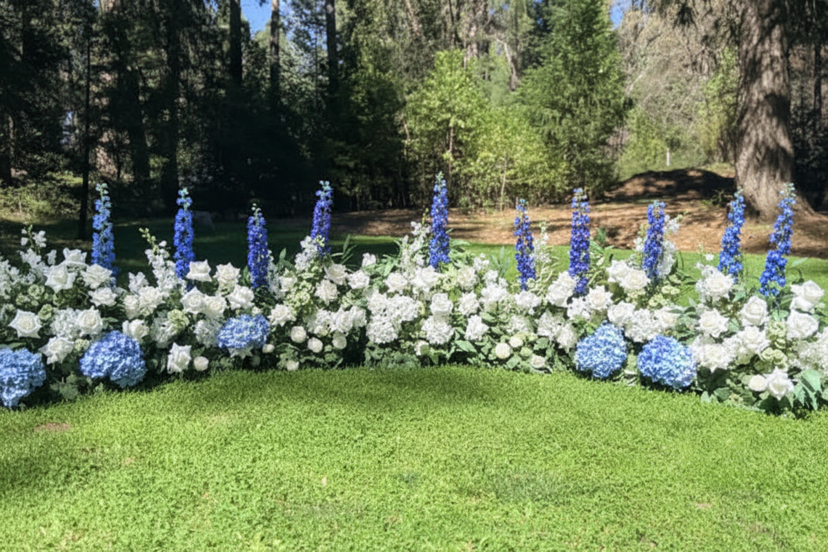 Blue delphiniums and hydrangeas pop of color floral arrangement
