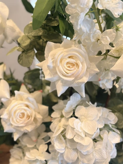 Macro close-up of Enchanted aisle flower rental blooms with cream white garden roses, white hydrangea, and white delphinium with lush eucalyptus | Reno, Lake Tahoe & Sacramento